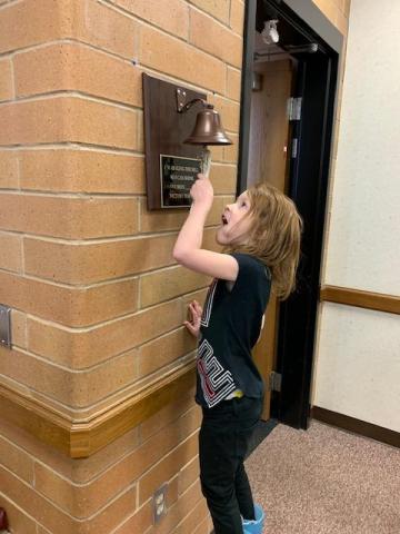 Student ringing victory bell
