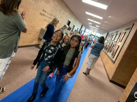 Students on the blue carpet